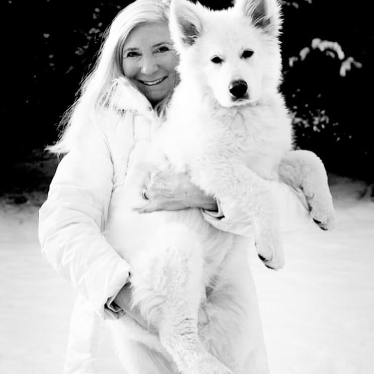 Woman and Berger Blanc Suisse Puppy Woman holding Berger Blanc Suisse Puppy